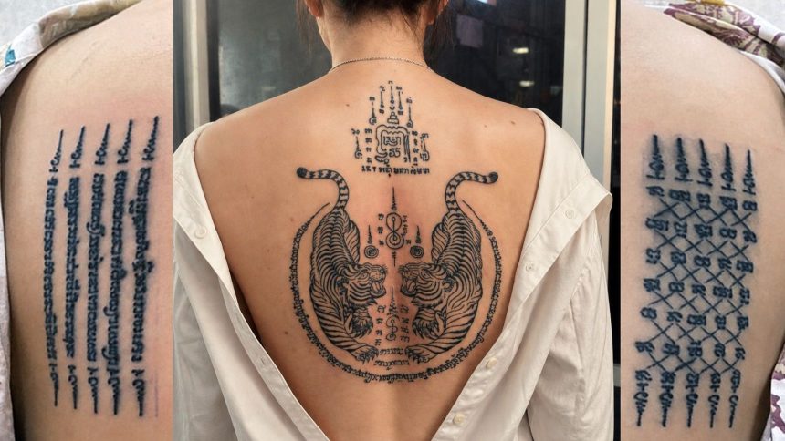 Tatouages sak yant traditionnels : lignes de yantra sur l'épaule et tigres jumeaux dans le dos